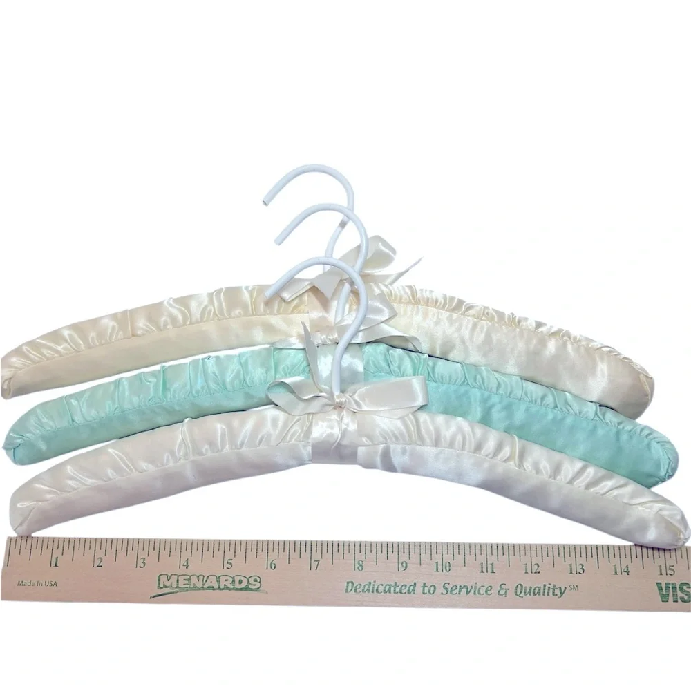 Three Luxurious Padded Satin Hangers-2 Cream and 1 Soft Blue Hanger.